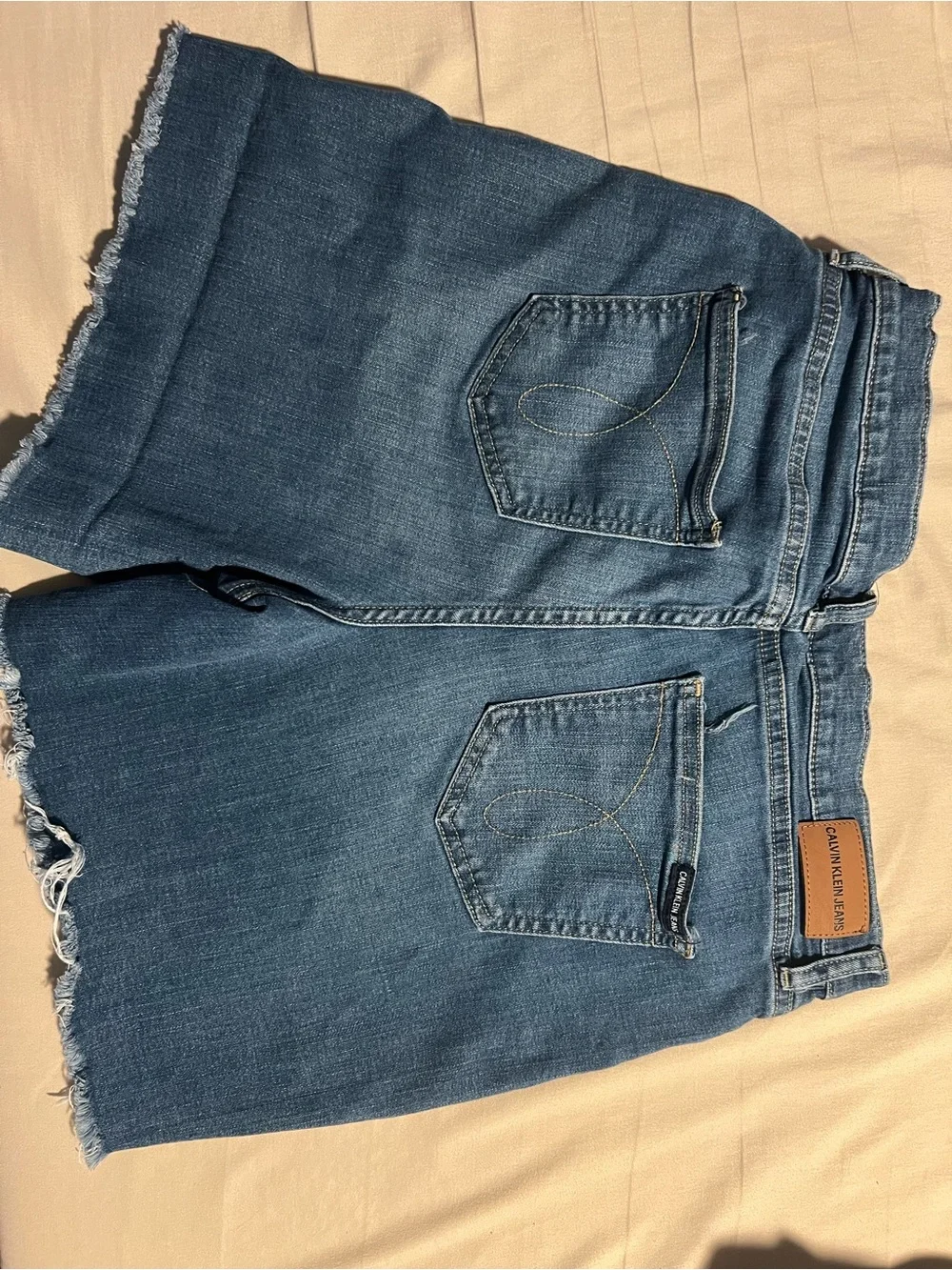 Calvin Klein Jeans Distressed Denim Shorts in Medium Blue